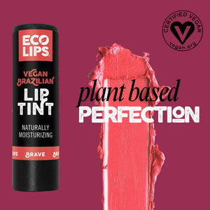 A customer holding up 'Brave' lip tint to display how the color is when applied to her lips.