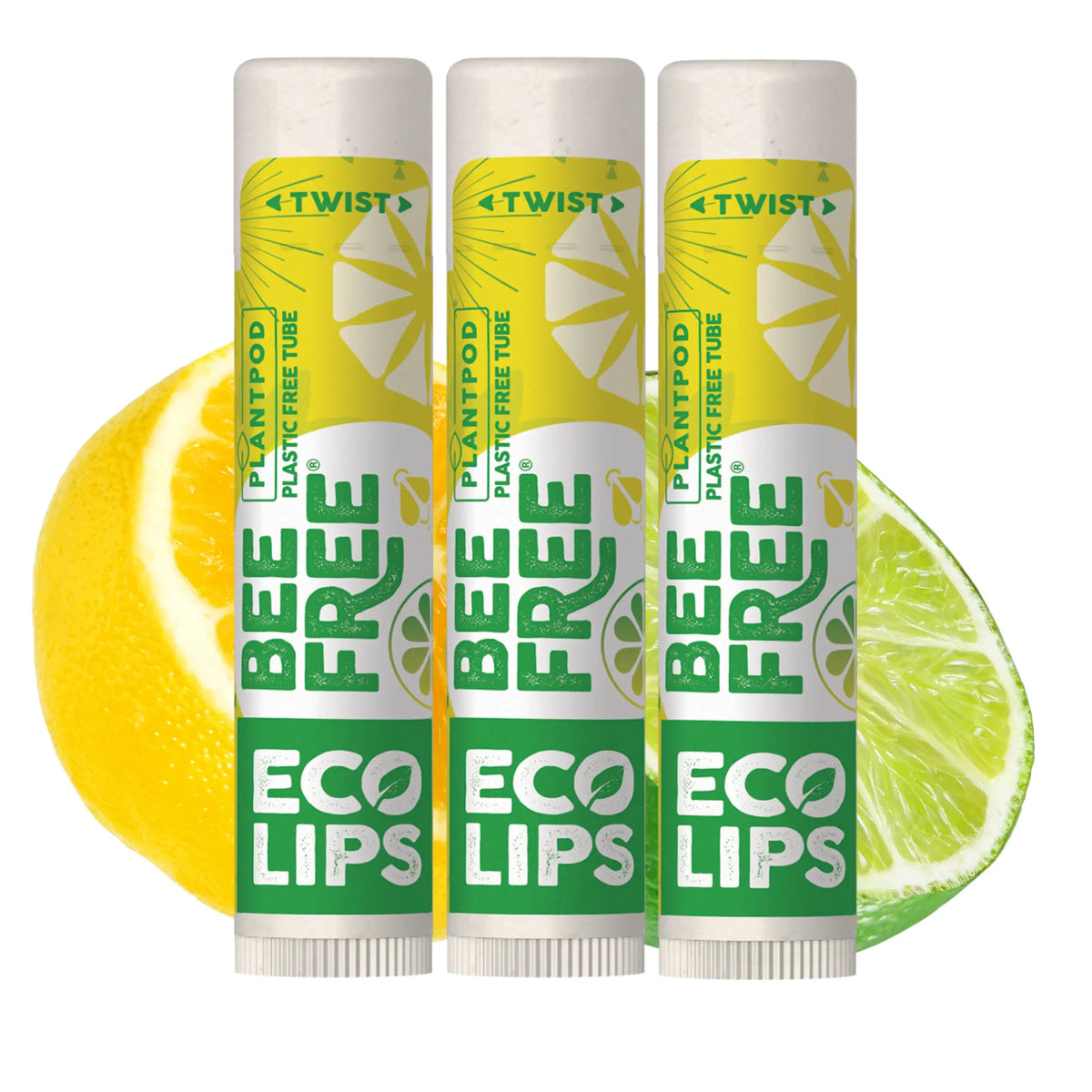 Three 'Bee Free Eco Lips' lip balm tubes with lemon and lime slices on a white background
