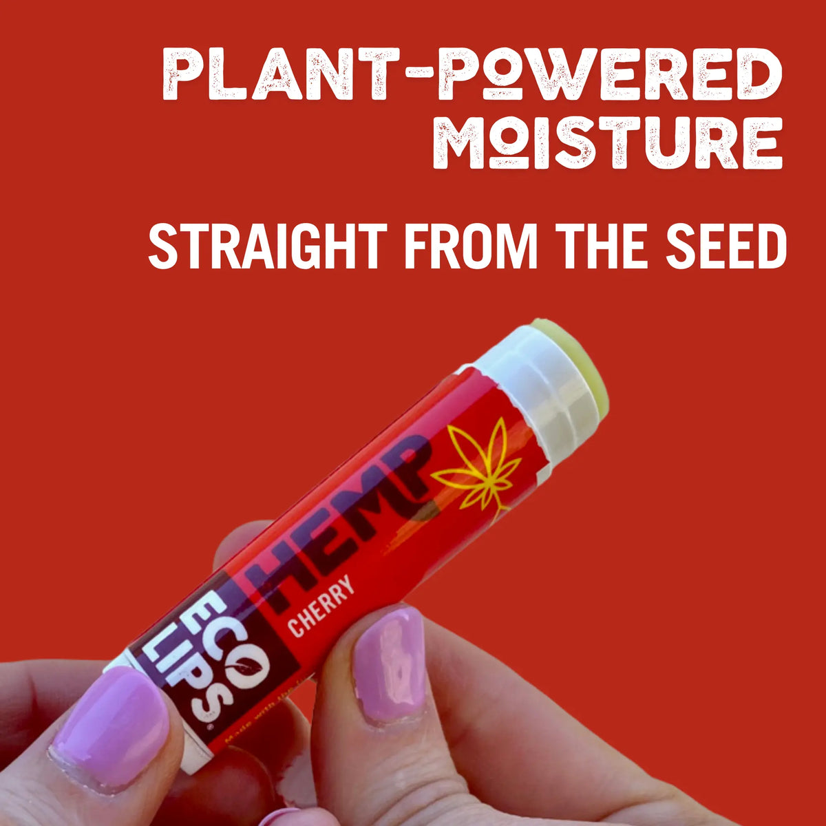 Hand holding a red lip balm with 'ECO Lips' branding against a red background