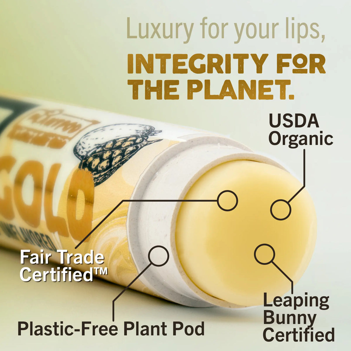 Lip balm packaging with certification labels on a light green background