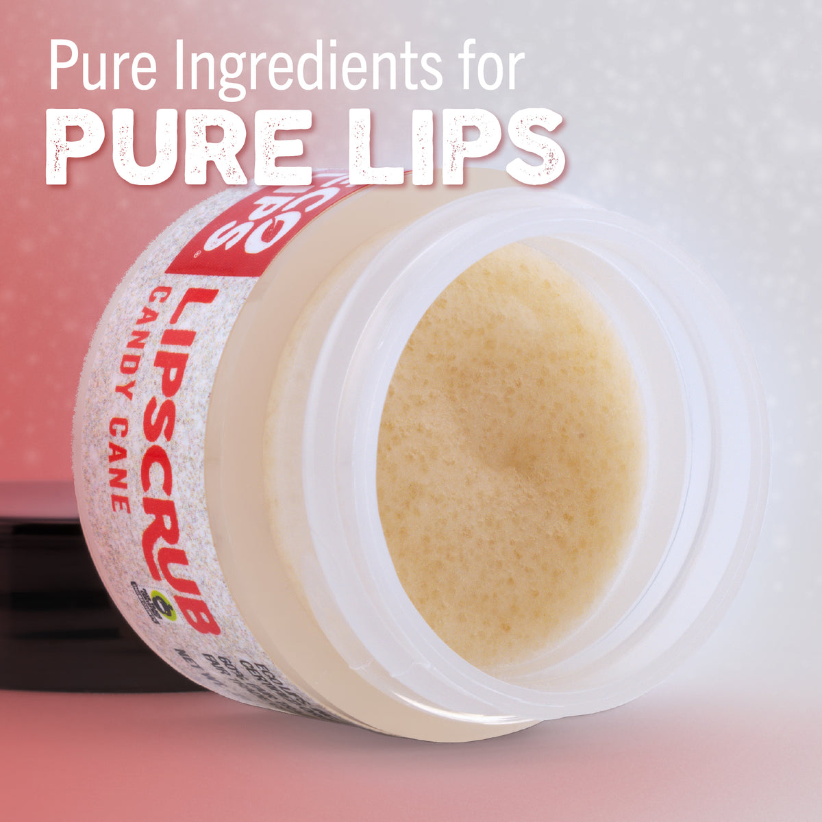 Jar of lip scrub with candy cane flavor text on a pink background
