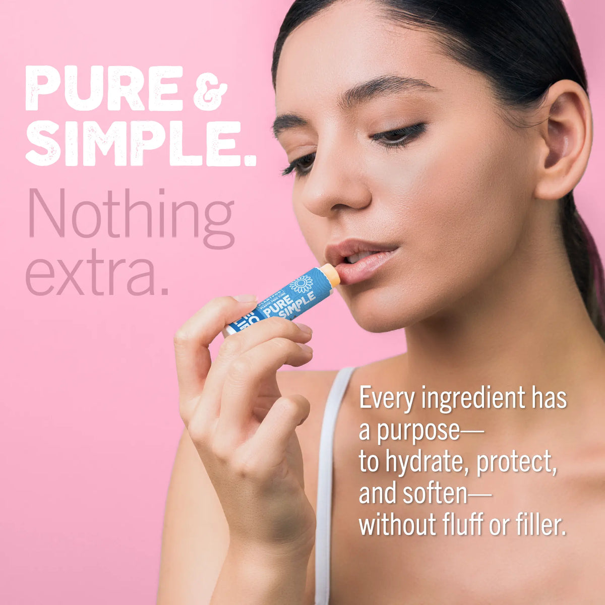 Woman holding a lip balm with text about purity and simplicity on a pink background