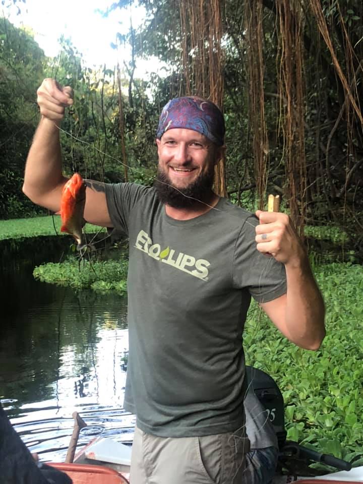 Man catching fish, enlarge image