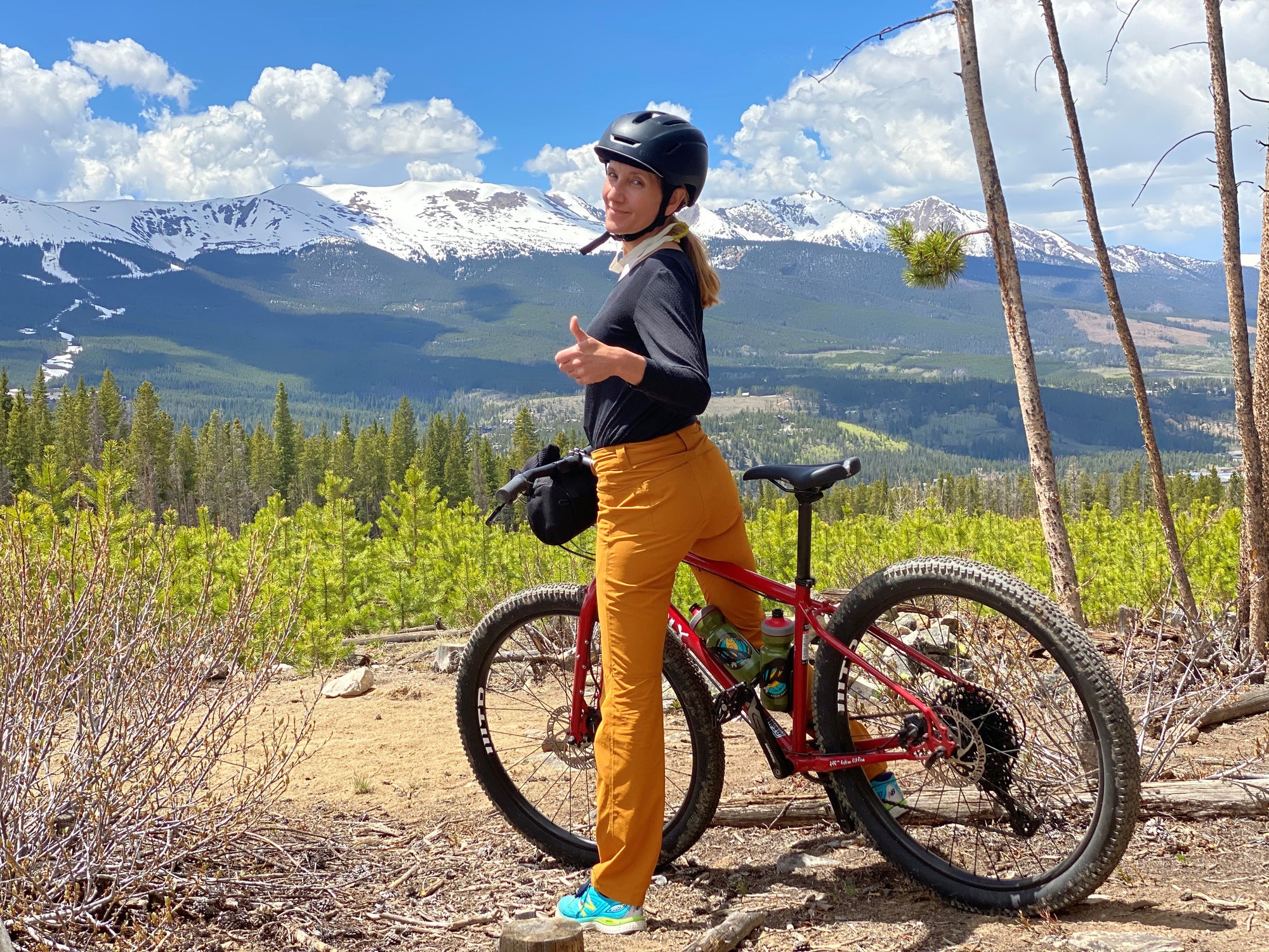 Woman mountain biking on a trail, enlarge image