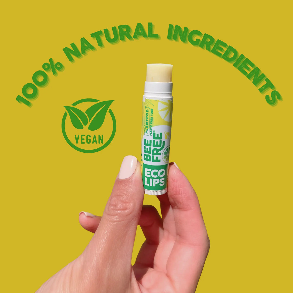 Lip balm with '100% Natural Ingredients' and 'Vegan' label on a yellow background